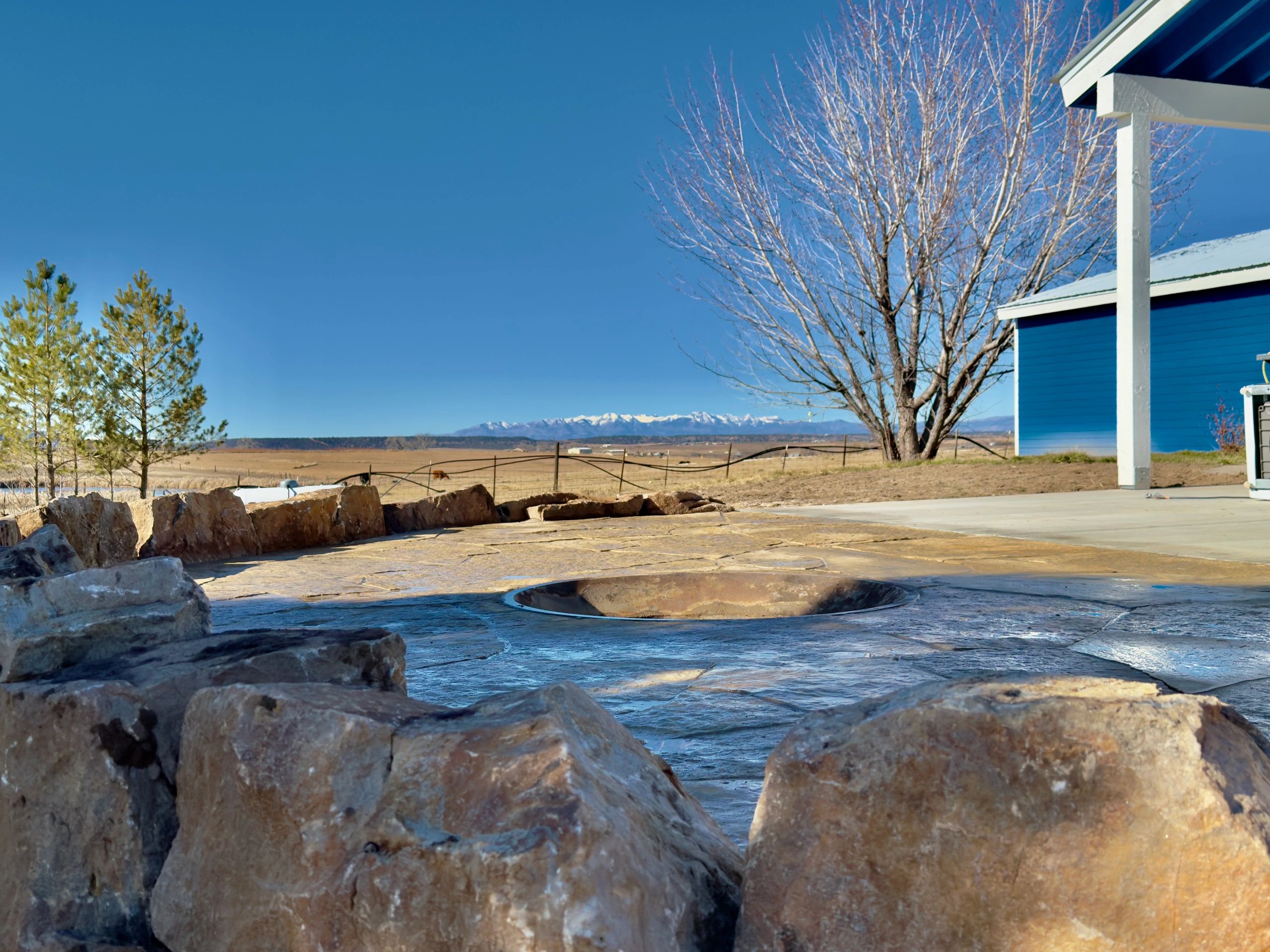 Flagstone Patio, Fire Pit and Moss Rock Install in Farmington, NM By Landscaper in Farmington, NM