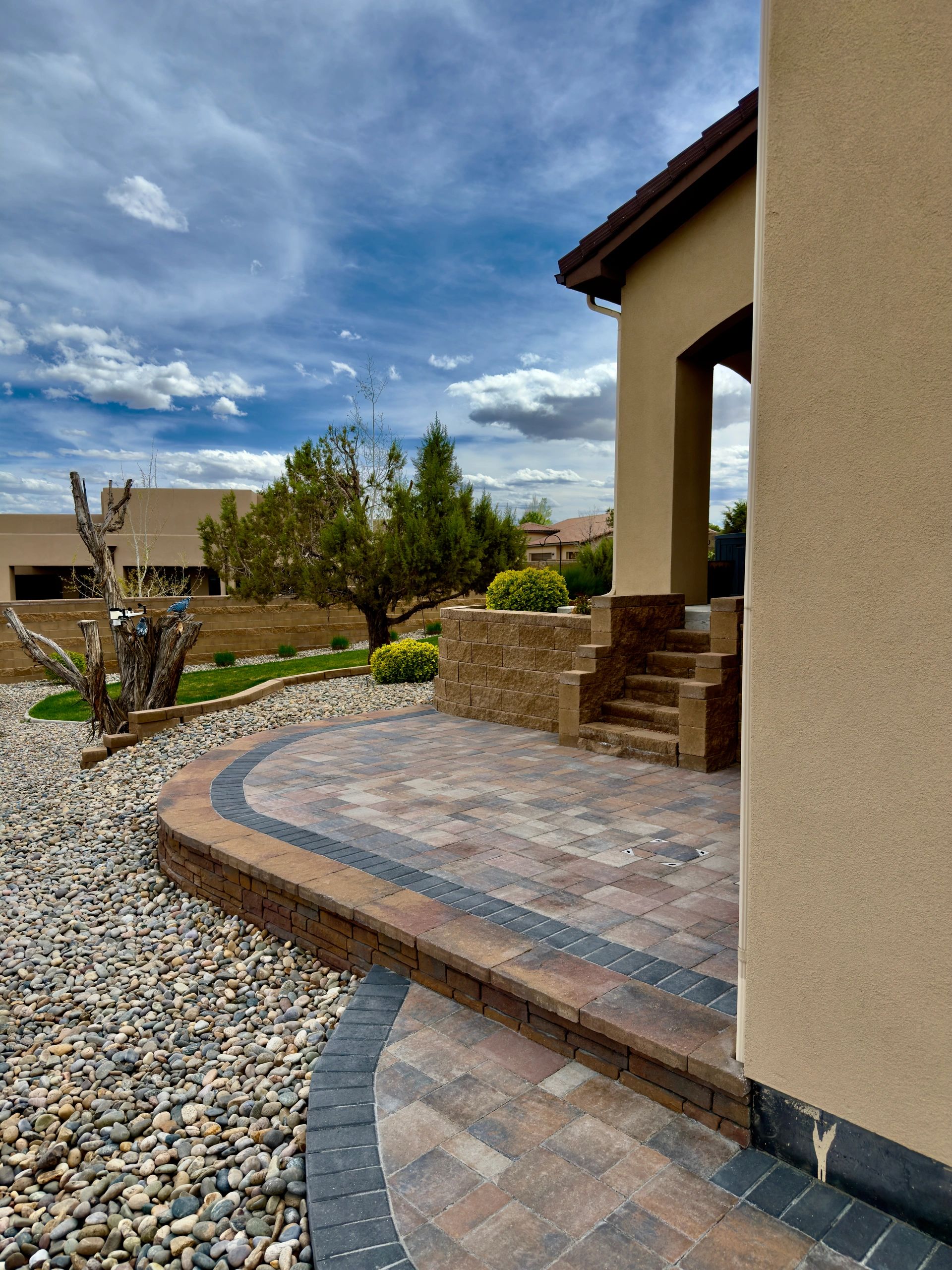 Raised Paver Patio with Retainment Wall Installed in Farmington, NM By Landscaper in Farmington, NM