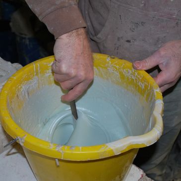 Blending by hand the limestone mix before filling the pattern