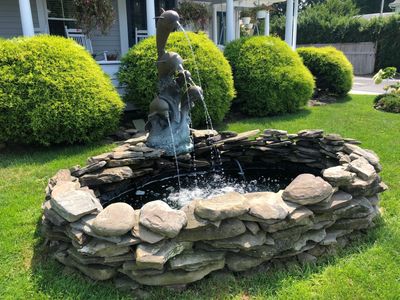 Dolphin water fountains located in the front yard of main building