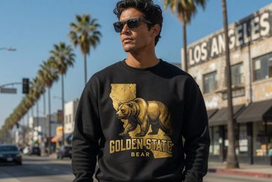 Man wearing a Golden State Bear sweatshirt on a sunny Los Angeles street.