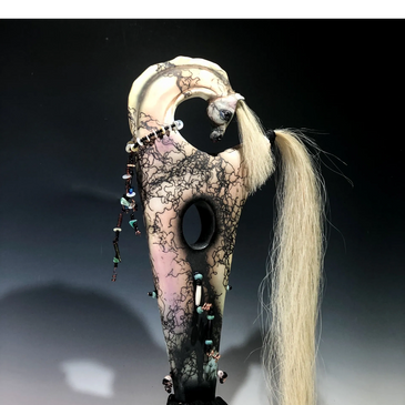 Original horse hair ceramic sculpture mounted on a wood base with leather, wire and bead adornments.