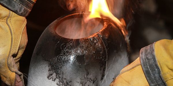 Flames erupt while CL Ramsdell is firing this one of a kind horse hair vase. 