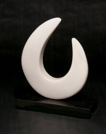 CO Yule marble sculpture in an arc shape. one peak higher than the other