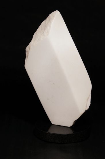 CO Yule Marble sculpture. rectangle-shaped,  two polished sides, two rough sides, slanted on one tip