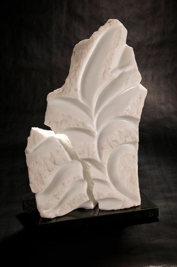 CO Yule marble sculpted as a large leaf that has an area showing a split in the leaf  
