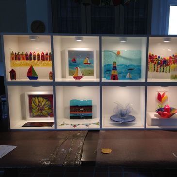 Display of fused glass.  Variety of fused glass and multimedia Art.  Can be made to order. 