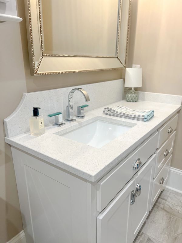 Crystal White Quartz Countertops. Backsplash Design. Guest Bath Installation. 