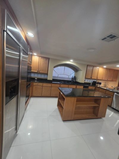 Fully cleaned kitchen with island and cabinets during move-out cleaning in Las Vegas