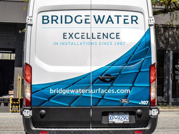 Rear view of a Bridgewater company van with branding and contact website.