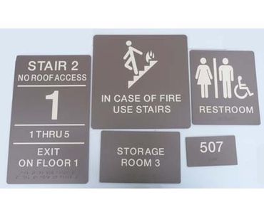 ADA Braille signage with raised text, rounded corners and clear braille.