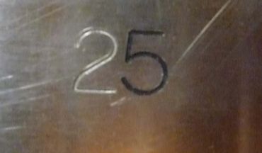 Custom engraving in stainless steel with paint fill.