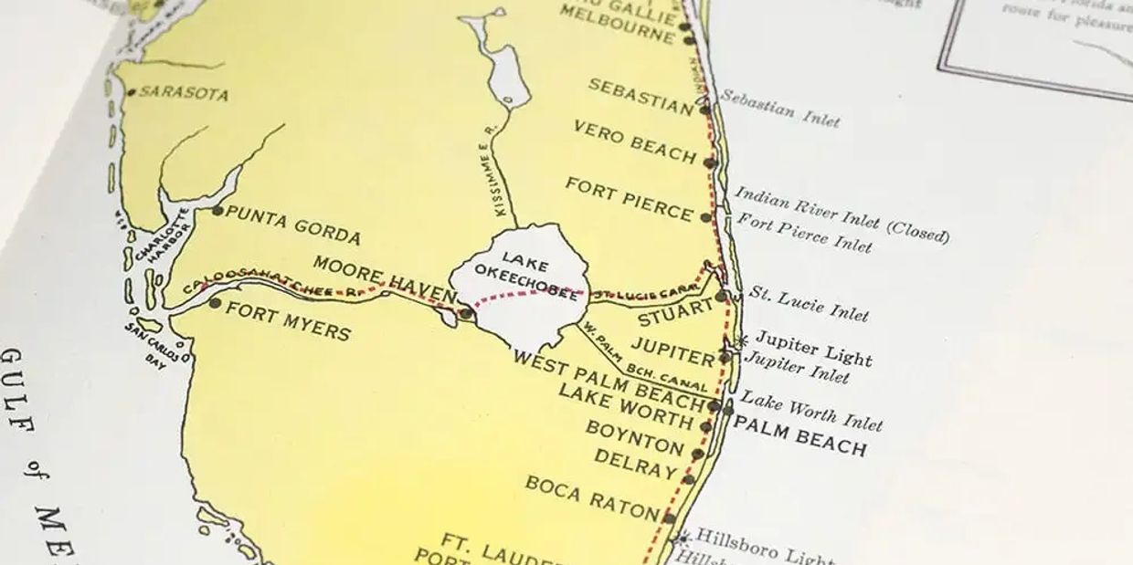 Close-up of a vintage Florida map showing coastal cities and waterways.