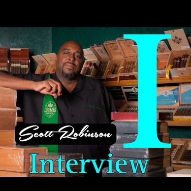 Man posing in a cigar shop with text 'Scott Robinson Interview'
