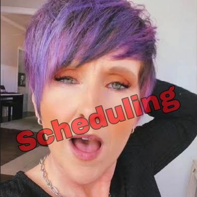 Person with purple hair and open mouth with 'Scheduling' text overlay.