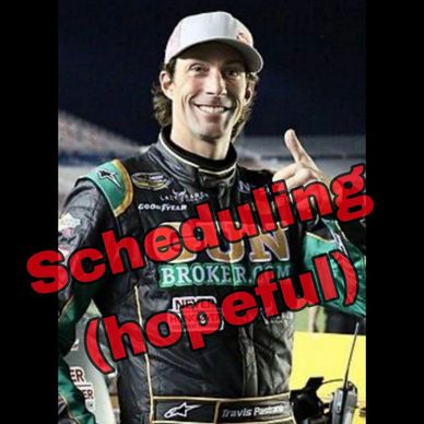Racecar driver giving a thumbs-up with 'Scheduling (hopeful)' text overlay.