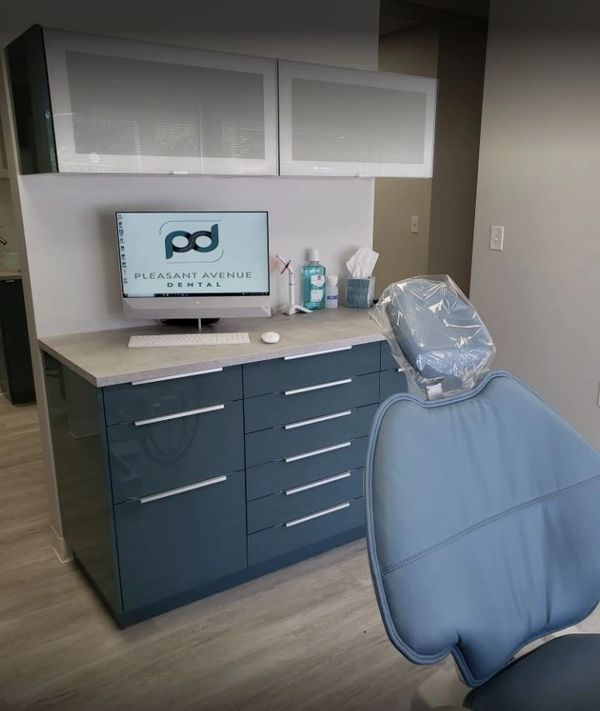 Modern dental office with equipment and chair.