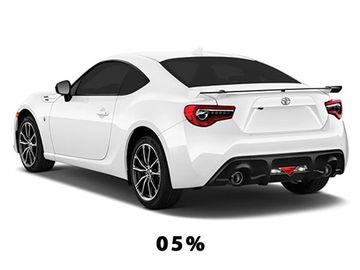White sports coupe car with black tinted windows and rear spoiler.