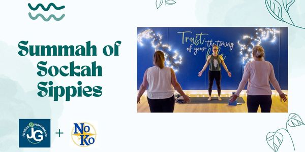 Yoga class with inspirational lighting and text on blue wall.