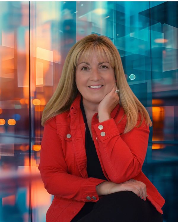 Professional woman in red jacket smiling