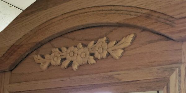 Floral detail on antique entry table