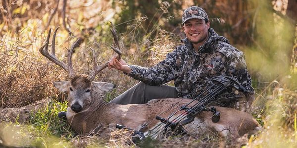 Man taking care of deer