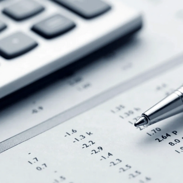 calculator data sheet and a pen