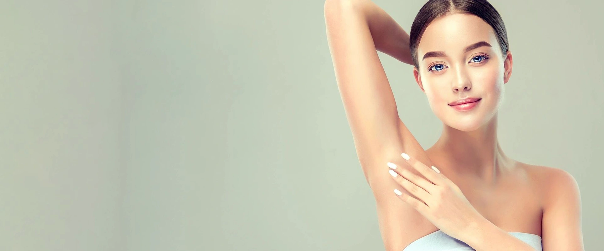 Blue-Eyed Woman is Touching the Clean, Soft Skin of Own Armpit