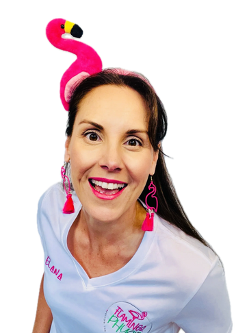 Elana smiling broadly wearing a pink flamingo headband and earrings.