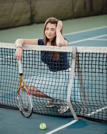 A young tennis player at the Cold Lake Tennis Courts.