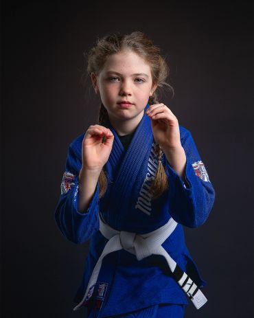 Kempe Fitness and Fighting Brazilian juijitsu student in Cold Lake Alberta posing in studio