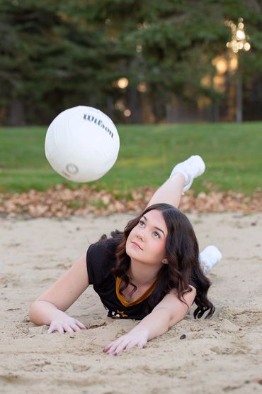 CLHS Royals Volleyball player going in for a pancake at the MD Camp ground in Cold Lake Alberta.