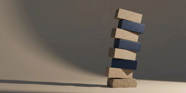 Stacked wooden blocks leaning against each other.