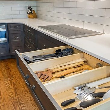 Custom cabinet drawer, for greater organization.  And enjoyment in the kitchen!