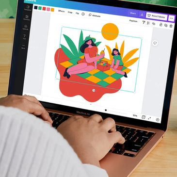 Designer preparing custom apparel and t-shirt designs at Printing Boss print shop in Lancaster CA
