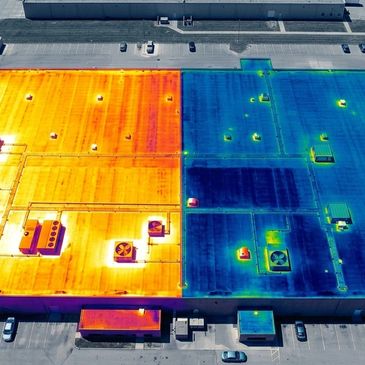 Thermal image showing temperature differences on a building's roof.