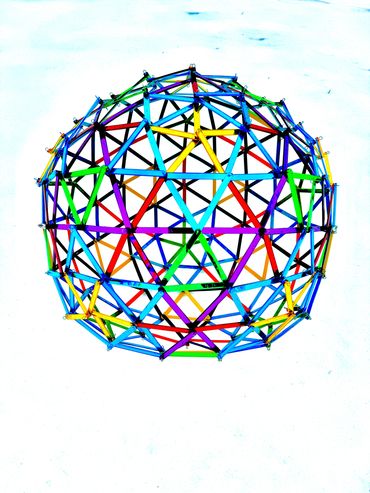 Colorful geometric dome structure on a snowy background.