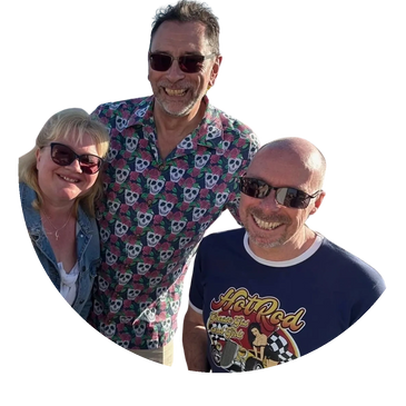 Three smiling adults wearing sunglasses, enjoying a sunny day.