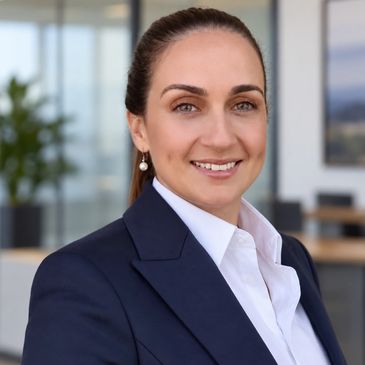 Professional woman smiling in office setting.