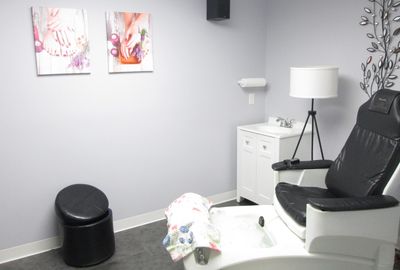 Whirlpool pedicure chair with hot bubbling water jets.  Black ottoman, lamp, sink & spa pictures.