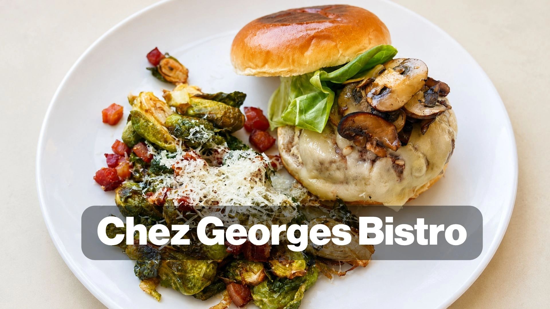 Mushroom burger with roasted Brussels sprouts and bacon on a white plate.