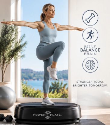 Woman exercising on a Power Plate machine indoors.
