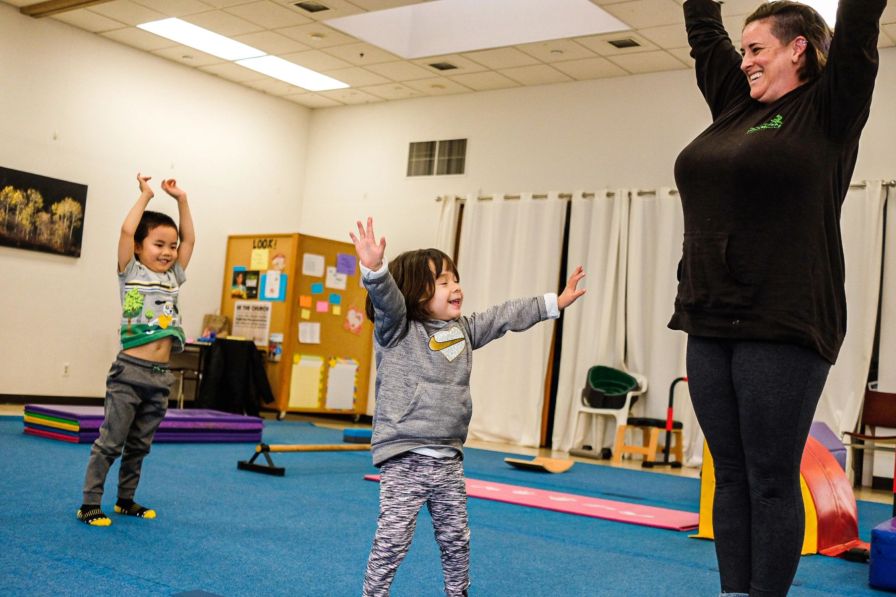 Children smiling and stretching