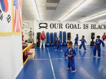 Martial arts class with students and instructor.