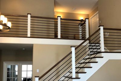 Interior Painting photo of staircase and upper floor railing refinish by Wilson Painting