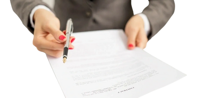 A person with pen ready to witness and verify signatures during a mobile notary near me, travel 