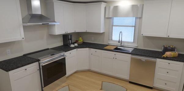 White Shaker 10x10 Kitchen Cabinets by Crafted Spaces Design Build Design Center