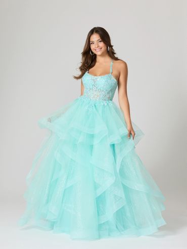 Young woman in a flowing aqua ball gown.