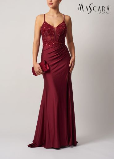 Elegant burgundy evening gown with intricate bodice.