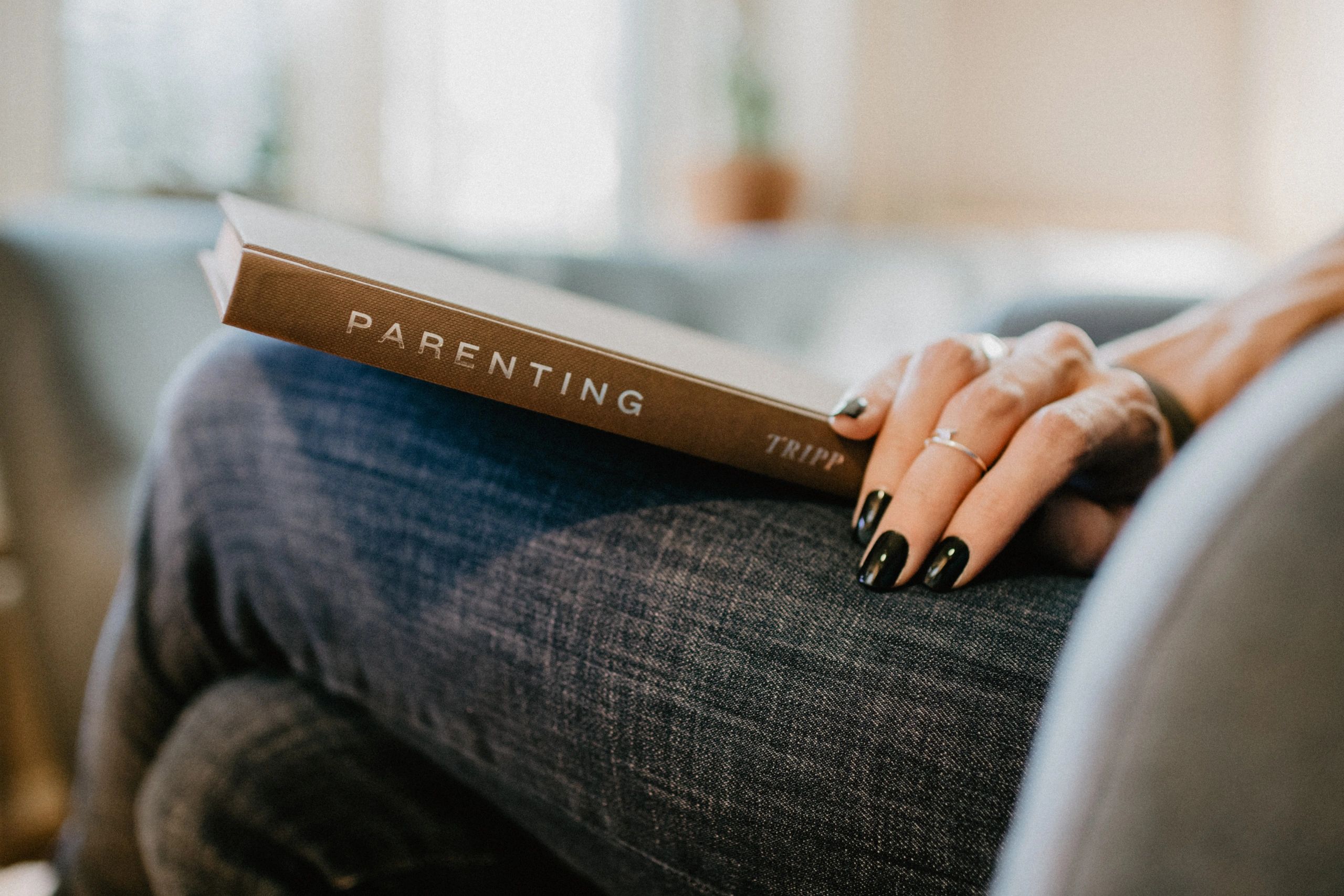 parenting book on lap